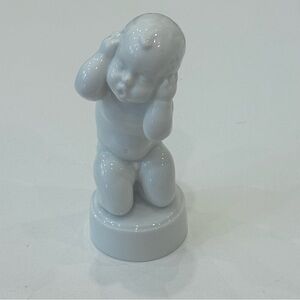 Royal Copenhagen White Porcelain Headache Left Figurine